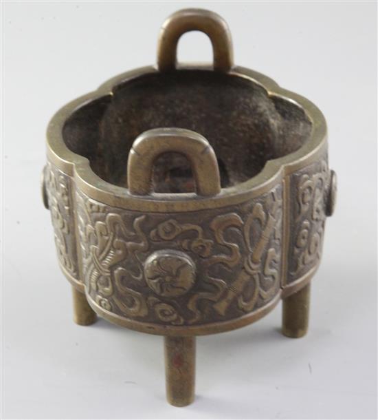 A Chinese quatrelobed bronze censer, Xuande mark, 18th/19th century, width 12.3cm, two legs replaced